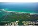 Panoramic aerial shot showcases beach, harbor, and stunning coastal community at 11000 Placida Rd # 702, Placida, FL 33946