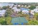 Community aerial view featuring condos, landscaping and tennis courts at 11000 Placida Rd # 702, Placida, FL 33946
