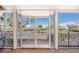 Private balcony showcasing beautiful views of the lake and surrounding community at 11000 Placida Rd # 702, Placida, FL 33946