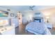 Cozy bedroom with a flat-screen TV, desk, and ensuite bathroom, offering a relaxing retreat at 11000 Placida Rd # 702, Placida, FL 33946