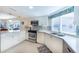 Bright kitchen featuring quartz countertops, stainless steel appliances, and ample cabinet space at 11000 Placida Rd # 702, Placida, FL 33946