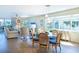Open-concept living and dining area with large windows, seamlessly connecting to a cozy living space at 11000 Placida Rd # 702, Placida, FL 33946