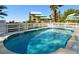 Inviting community pool with crystal-clear water, surrounded by lush landscaping at 11000 Placida Rd # 702, Placida, FL 33946