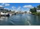 Scenic waterfront view with boats docked along the canal and beautiful waterfront homes at 11000 Placida Rd # 702, Placida, FL 33946