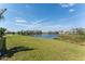 View of the backyard with a pond at 12 Sportsman Ter, Rotonda West, FL 33947