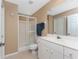 Bathroom featuring a tiled walk-in shower, commode, and a vanity at 12 Sportsman Ter, Rotonda West, FL 33947