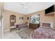 Guest bedroom featuring two twin beds, a window, tile flooring, and light colored walls at 12 Sportsman Ter, Rotonda West, FL 33947