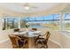 A breakfast nook surrounded by windows overlooking water views at 12 Sportsman Ter, Rotonda West, FL 33947