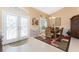 Dining room features a decorative chandelier and elegant double door entry at 12 Sportsman Ter, Rotonda West, FL 33947