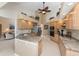 Spacious kitchen with granite countertops, wood cabinets, stainless steel appliances and ceiling fan at 12 Sportsman Ter, Rotonda West, FL 33947