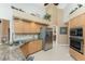 Well-lit kitchen with stainless steel appliances and granite countertops at 12 Sportsman Ter, Rotonda West, FL 33947