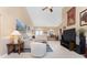 Bright living room with high ceilings, neutral tones, and comfortable seating at 12 Sportsman Ter, Rotonda West, FL 33947