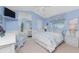 Bright main bedroom with a ceiling fan, a queen size bed, and large closet with mirrored doors at 12 Sportsman Ter, Rotonda West, FL 33947