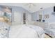 Bright main bedroom with a ceiling fan, vaulted ceilings, and a white dresser at 12 Sportsman Ter, Rotonda West, FL 33947