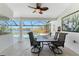 Screened patio includes dining set with water view and access to pool at 12 Sportsman Ter, Rotonda West, FL 33947