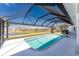 Screened-in pool overlooking a scenic water view at 12 Sportsman Ter, Rotonda West, FL 33947