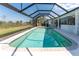 Spacious screened pool area with clear blue water and ample sunlight at 12 Sportsman Ter, Rotonda West, FL 33947