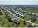 Panoramic aerial view of residential homes alongside a scenic canal, showcasing the community at 127 White Marsh Ln, Rotonda West, FL 33947