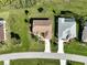Aerial view of single Gathering home featuring a manicured lawn at 127 White Marsh Ln, Rotonda West, FL 33947