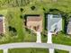 From above, this home features mature landscaping, a manicured lawn, and neighbors with screened pools at 127 White Marsh Ln, Rotonda West, FL 33947