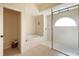 Bright bathroom with a glass-enclosed shower, soaking tub, tiled walls, and ceramic tile flooring at 127 White Marsh Ln, Rotonda West, FL 33947