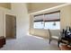 Cozy bedroom featuring carpet floors, a desk, and a window for natural light at 127 White Marsh Ln, Rotonda West, FL 33947