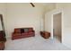 Bedroom with a sofa and doorway to a walk-in closet at 127 White Marsh Ln, Rotonda West, FL 33947