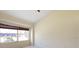 Bedroom featuring carpet floors, light-filled window and views of the neighborhood at 127 White Marsh Ln, Rotonda West, FL 33947