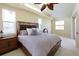 Well-lit bedroom with ceiling fan and natural light at 127 White Marsh Ln, Rotonda West, FL 33947