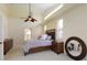 Comfortable bedroom with ceiling fan and natural light at 127 White Marsh Ln, Rotonda West, FL 33947
