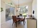 Bright dining area with sliding glass door to outdoor space at 127 White Marsh Ln, Rotonda West, FL 33947