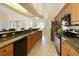 Well-lit kitchen with stainless appliances and open floor plan at 127 White Marsh Ln, Rotonda West, FL 33947