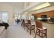 Open kitchen with bar seating and view to dining area at 127 White Marsh Ln, Rotonda West, FL 33947