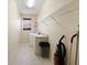 Bright laundry room with washer, dryer, and storage space at 127 White Marsh Ln, Rotonda West, FL 33947