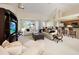 Spacious living room featuring high ceilings, neutral tones, and seamless flow to the kitchen at 127 White Marsh Ln, Rotonda West, FL 33947