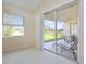Bright room with sliding glass doors leading to outdoor patio at 127 White Marsh Ln, Rotonda West, FL 33947