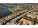 An aerial view capturing the community's layout, including lakefront properties, pool, and clubhouse at 13137 Oriago St, Venice, FL 34293