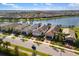 Beautiful aerial view of waterfront homes showcasing well-manicured lawns and tile roofs at 13137 Oriago St, Venice, FL 34293
