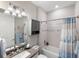 Clean bathroom with gray vanity, tub and shower combination, and coastal decor at 13137 Oriago St, Venice, FL 34293