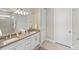 This bathroom features dual sinks with granite countertops and a walk-in shower at 13137 Oriago St, Venice, FL 34293