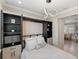 Tastefully designed bedroom with murphy bed, modern lighting, and convenient built-in storage at 13137 Oriago St, Venice, FL 34293