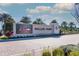 Wellen Park community entrance featuring the Atlanta Braves signage, palm trees, and lush landscaping at 13137 Oriago St, Venice, FL 34293