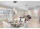 Bright dining area with chandelier lighting, and seamless connection to the living spaces at 13137 Oriago St, Venice, FL 34293