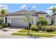Beautiful single-story home with a brick driveway and well-maintained landscaping at 13137 Oriago St, Venice, FL 34293
