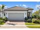 Charming single-Gathering home featuring a brick driveway, tile roof, and well-maintained landscaping at 13137 Oriago St, Venice, FL 34293