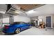 Well-maintained garage with epoxy flooring, overhead storage, and a side door at 13137 Oriago St, Venice, FL 34293