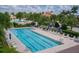 Aerial view of the community's lap pool, complete with lounge chairs and meticulously maintained surrounding landscape at 13137 Oriago St, Venice, FL 34293