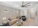 Comfortable living room with tile floors, modern ceiling fan, and neutral decor at 13137 Oriago St, Venice, FL 34293