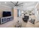 Spacious living room with modern fireplace, neutral palette and open floor plan at 13137 Oriago St, Venice, FL 34293