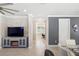 Open concept living space with gray accents and a view of the office space at 13137 Oriago St, Venice, FL 34293